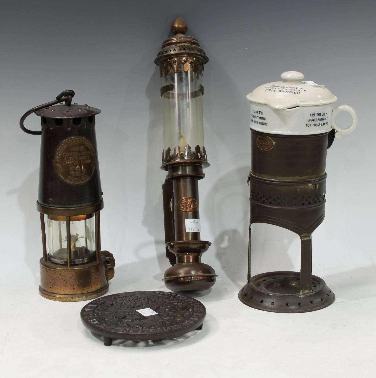 An Eccles miners lamp, type SL No.B120, 201; a GWR wall mounted oil lamp; a Sam L. Clarke's patent