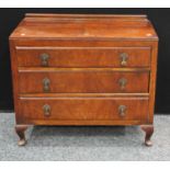 A mahogany chest of drawers, rectangular top above three long drawers.
