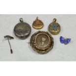 A silver pendant locket; a pinchbeck mourning brooch; a pinchbeck locket; a silver and enamel