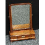 A Regency mahogany dressing table mirror, the rectangular mirror with brass urnular finials, three