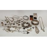 A sterling silver hinged bangle; rings; bracelets; necklaces; charm bracelet and charms; curb link