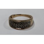 A diamond cluster ring, tapering crest pave encrusted with thirty three round brilliant cut