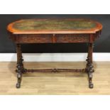 A Victorian walnut bowed rectangular writing table, moulded top with inset tooled and gilt leather