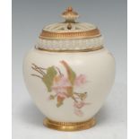 A Royal Worcester lobed ovoid pot pourri vase and cover, decorated with flower sprigs, on a blush