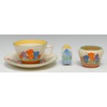 A Clarice Cliff Crocus pattern teacup and saucer, brightly painted with blue, orange and purple