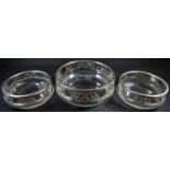A garniture of three German Neo-Classical Revival silver mounted clear glass table bowls, the