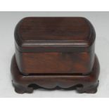 A Chinese hardwood rounded rectangular box and cover, quite plain, the shaped stand with bracket