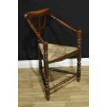 A 19th century elm thrown turners armchair, in the 17th century manner, rush seat, 87cm high, c.1880