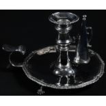 A George III silver tripod chamberstick, the detachable crested nozzle, campagna sconce and shaped