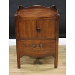 A George III mahogany tray top night table, wavy gallery with pierced handles, above a pair of doors