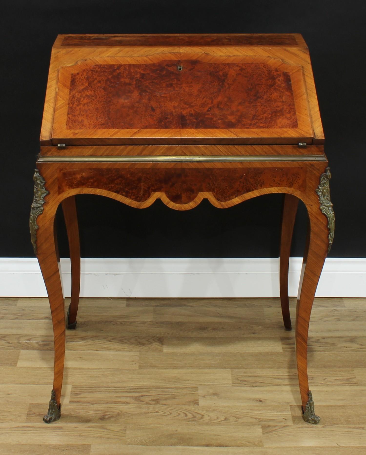 A 19th century French gilt metal mounted rosewood and amboyna bureau du dame, fall front enclosing a