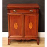 An Edwardian Sheraton Revival mahogany and marquetry batchelor's cabinet, folding top above a frieze