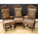 A set of six Victorian Baronial oak dining chairs, in the Renaissance Revival taste, arched cresting