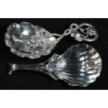A Victorian silver caddy spoon, stamped and embossed with flowering stems, 8.5cm long, Hilliard &
