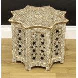 A Middle Eastern hardwood, ivory and mother-of-pearl marquetery star shaped occasional table,
