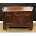 An 18th century oak ark, gabled top, the front with three raised and fielded panels, stile feet,