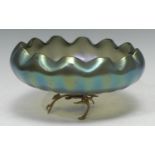 An Art Nouveau iridescent bowl, gilt metal branch feet, 21cm diam, marked L.C.T.