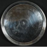 A George III silver circular salver, the field crested and engraved with a band of Greek key,