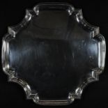 An Edwardian silver quatrefoil salver, quite plain, piecrust border, 32.5cm diam, Roberts & Belk,