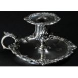 A William IV Rococo Revival silver chamber stick, detachable nozzle, acanthus-capped scroll