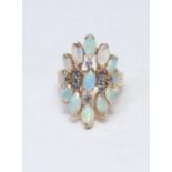 An unusual mid 20th century opal and sapphire cluster ring, inset with thirteen individually mounted