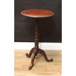 A Victorian oak tripod wine table, circular top with carved edge, turned and carved pillar, cabriole