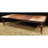 A Victorian mahogany wind-out dining table, rounded rectangular moulded top above a deep frieze,