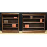 A suite of Victorian mahogany open bookcases, moulded rectangular tops above adjustable shelves,