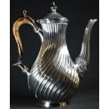 A Victorian silver spirally fluted baluster coffee pot, hinged domed cover, ebonised scroll capped