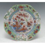A Chinese 18th century octagonal plate, decorated with red, green and blue foliage, the rim with