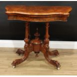 A Victorian burr walnut serpentine card table, folding top with matched veneers enclosing a baize