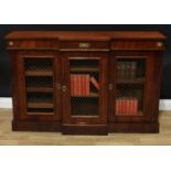 A mahogany breakfront bookcase, three mesh faced doors, enclosing shelving plinth base, 80cm high,