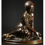 Grand Tour School (19th century), a brown patinated bronze, Girl Playing Knuckle Bones, oval base,