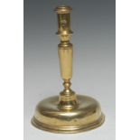 A late 17th century brass candlestick, cylindrical sconce, substantial domed base, 22cm high, c.1690