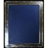 A large Elizabeth II silver easel photograph frame, ribbon-wrapped reeded border, 30cm high, the