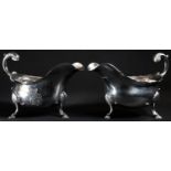 A pair of George III silver sauce boats, flying acanthus scroll handles, shell and hoof feet, 18cm