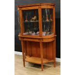 A Sheraton Revival satinwood connoisseur's display cabinet on stand, moulded cornice above a
