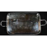 A George III silver rounded rectangular bacon dish, gadrooned borders, reeded loop handles, 29cm