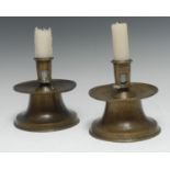 A rare pair of 16th century Spanish brass capstan candlesticks, pierced cylindrical sockets,