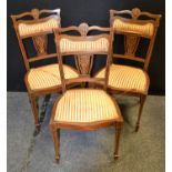 A set of three late Victorian mahogany salon chairs inlaid in coloured woods, c.1900