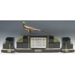 An Art Deco French marble and onyx three piece clock garniture, rectangular silvered dial with
