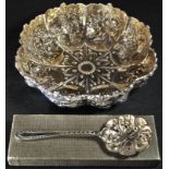 A Victorian silver lobed circular strawberry dish, chased with fruit and flowers, gilt interior,