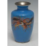 A Chinese cloisonne enamel ovoid vase, decorated in polychrome with a phoenix, on a pale blue