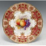 A Royal Worcester shaped circular plate, painted by Albert Shuck, signed, with apples and grapes,