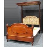 A Victorian mahogany half tester bed, moulded cornice, arched footboard applied with an oval panel