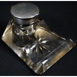 An Edwardian silver mounted clear glass desk inkwell, higed cover with integral pocket watch