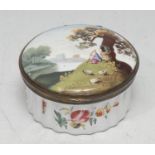 A George III South Staffordshire enamel circular snuff box, hinged cover painted with a shepherd