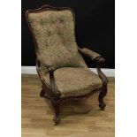 A Victorian mahogany drawing room chair, serpentine cresting rail, outswept arms carved with