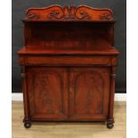 A William IV mahogany pier cabinet, rectangular superstructure with shaped cresting carved and