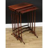 A Post-Regency rosewood nest of three rectangular occasional tables, turned legs, downswept legs,